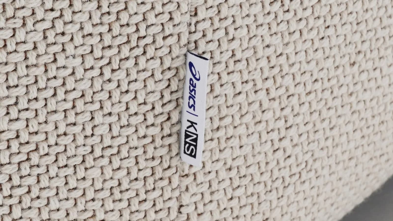 KNS × ASICS Polar Lounge Chair, embroidered collaboration tag